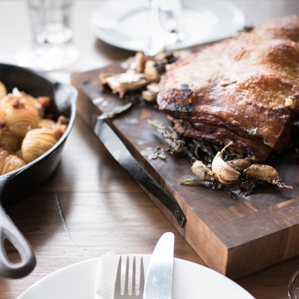 rustic-roast-pork-dish-roasted-garlic-scored-potatoes-family-meal-served-with-a-glass-of-red-wine-in_t20_XzbPgl rustic-roast-pork-dish-roasted-garlic-scored-potatoes-family-meal-served-with-a-glass-of-red-wine-in_t20_XzbPgl